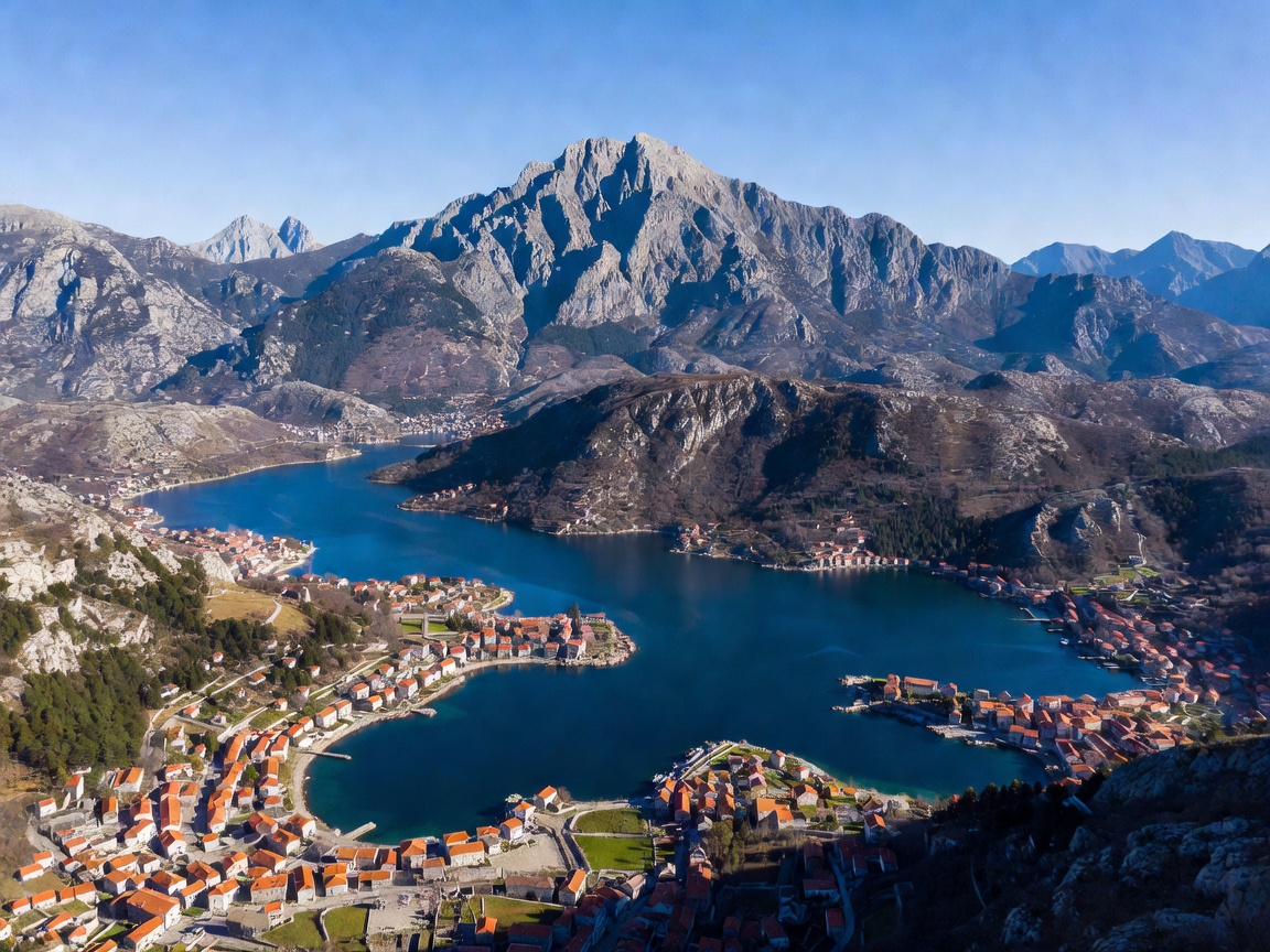 Aerial view of Boka Bay with coastal waters, historic stone villages, and towering mountains